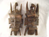 Appraisal: Two African tribal masks with bird crests eye slits scarification