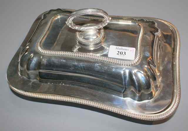 Appraisal: A PAIR OF SILVER PLATED ENTR E DISHES AND COVERS