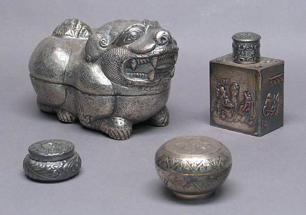 Appraisal: Two Asian silver decorations Including a Cambodian style silver lion-shaped