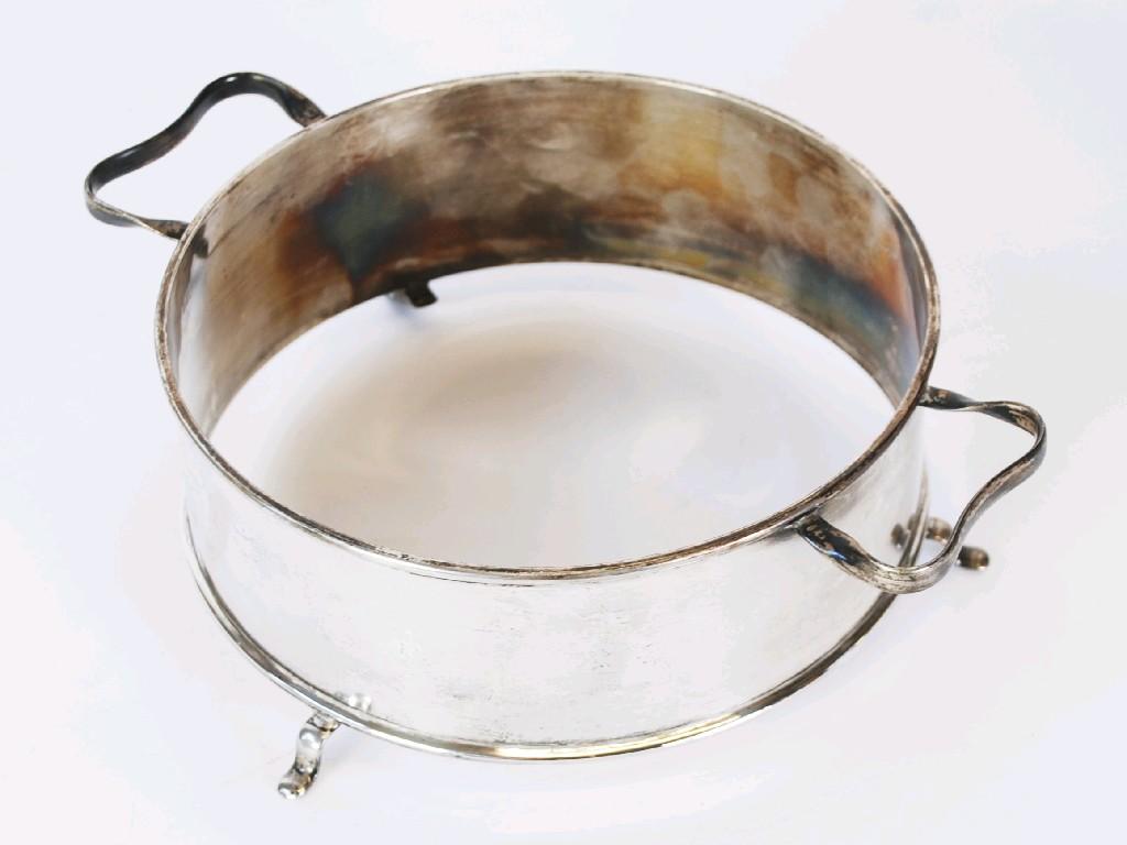 Appraisal: SILVER CIRCULAR TWO HANDLED DISH STAND with plain straight sides