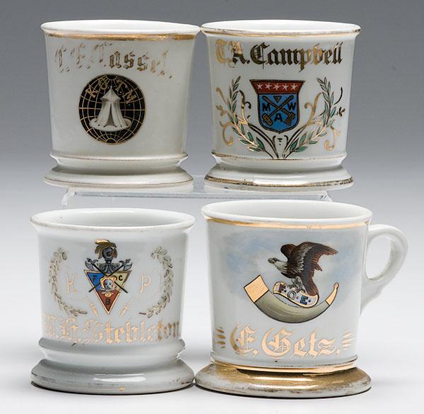 Appraisal: FOUR FRATERNAL SHAVING MUGS porcelain with polychrome painted fraternal symbols