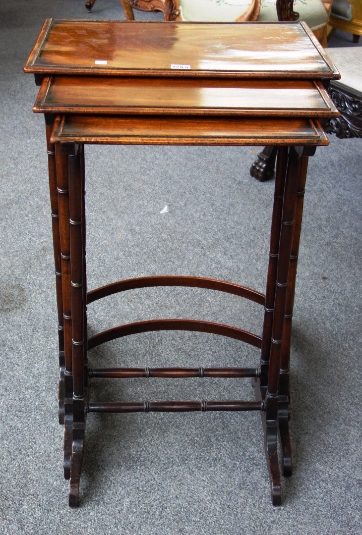 Appraisal: A nest of three Regency mahogany occasional tables on turned