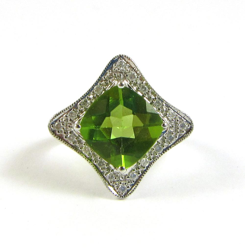 Appraisal: PERIDOT DIAMOND AND FOURTEEN KARAT GOLD RING The k white