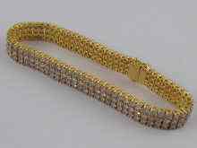 Appraisal: An carat gold three row diamond line bracelet set with