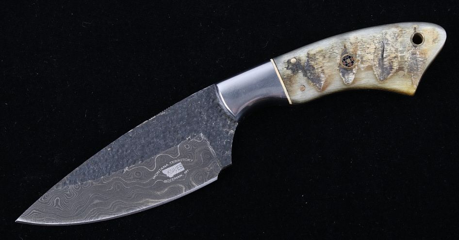 Appraisal: M T Knives Rams Horn Damascus Hammered Knife This is