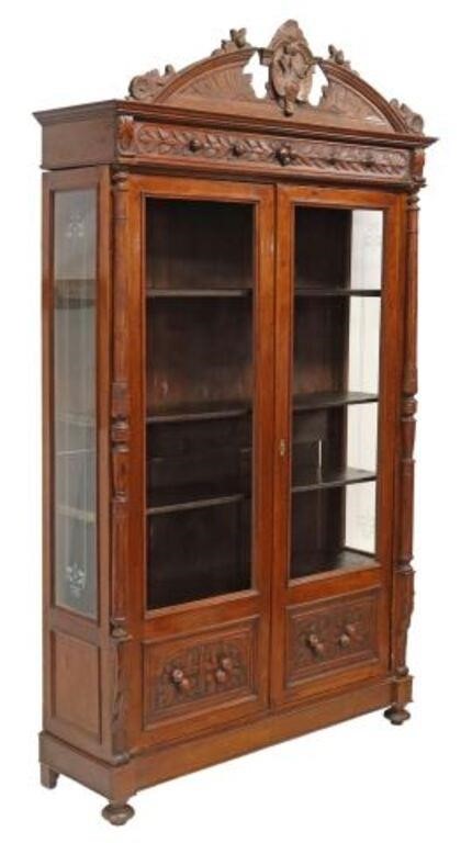 Appraisal: Italian carved walnut bookcase th c crest with game bird