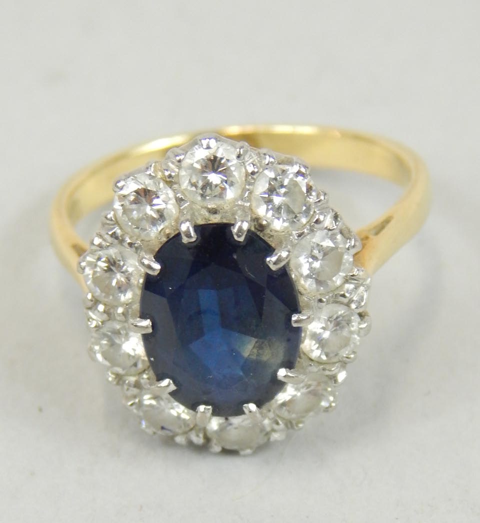 Appraisal: A diamond and sapphire cluster ring the central dark sapphire