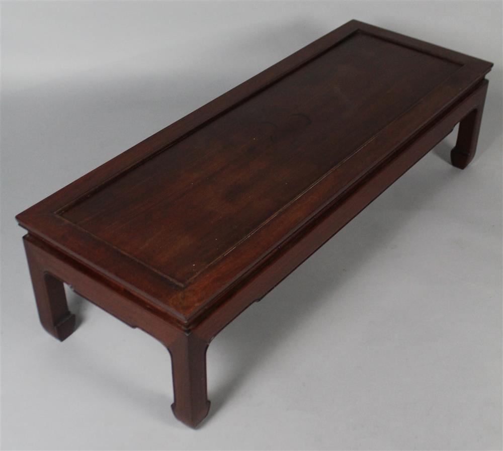 Appraisal: ASIAN HARDWOOD LOW LONG COFFEE TABLE having a wide mitred