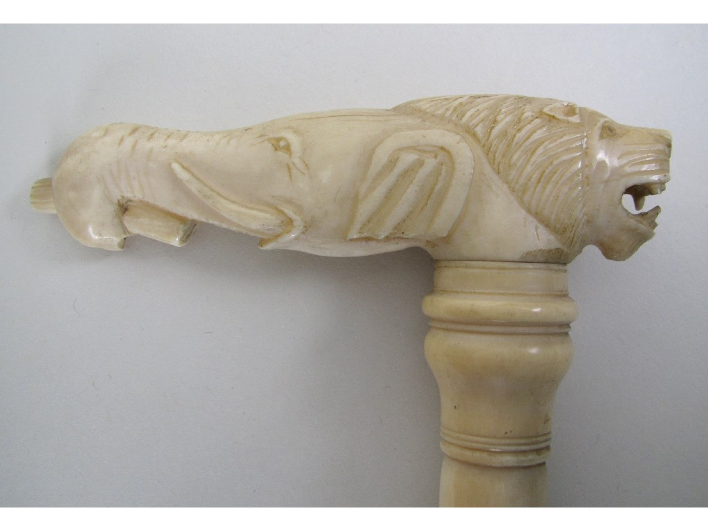 Appraisal: An Anglo Indian sectional ivory walking stick the handle carved