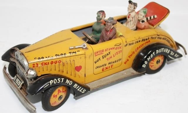 Appraisal: ARNOLD TIN LIZZIE TIN LITHOGRAPH REMOTE CONTROLCAR TOY COMPOSITION FIGURES