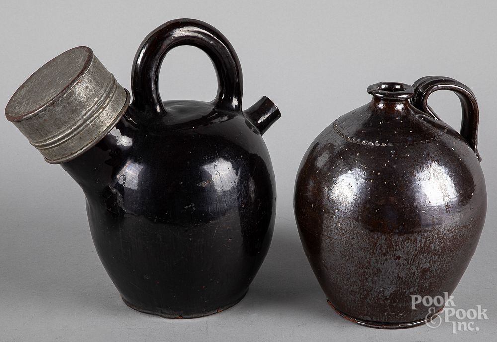 Appraisal: Redware harvest jug and ovoid jug th c Redware harvest