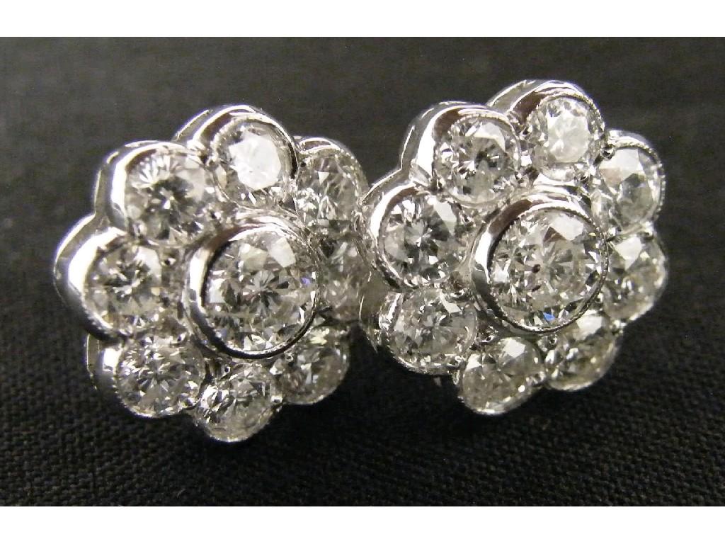 Appraisal: Pair of attractive white gold and floral set nine stone