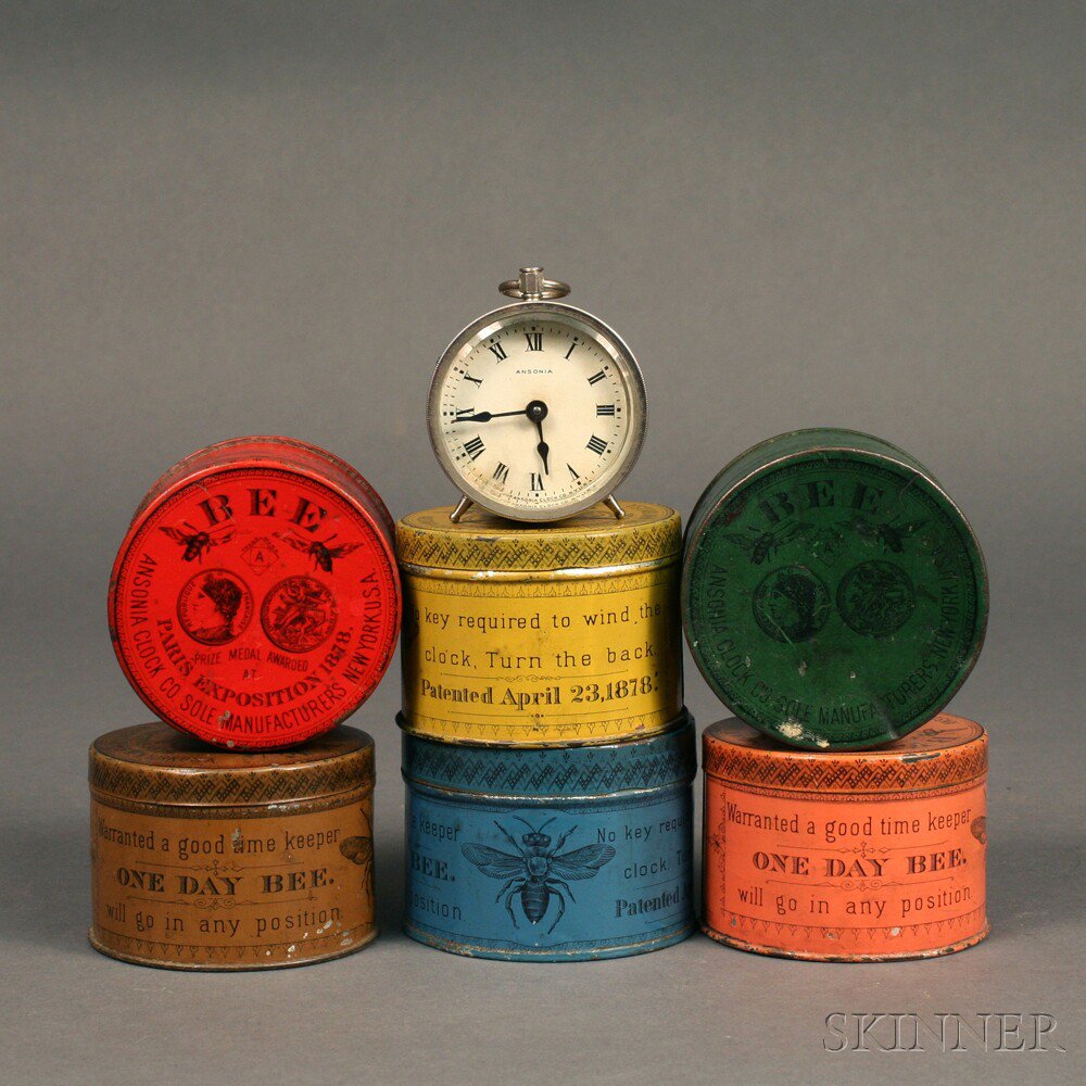 Appraisal: Six Ansonia Bee Shipping Tins and a Bee Clock Brooklyn