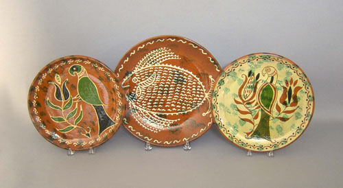 Appraisal: Three Seagreaves redware chargers dia and dia Provenance Collection of