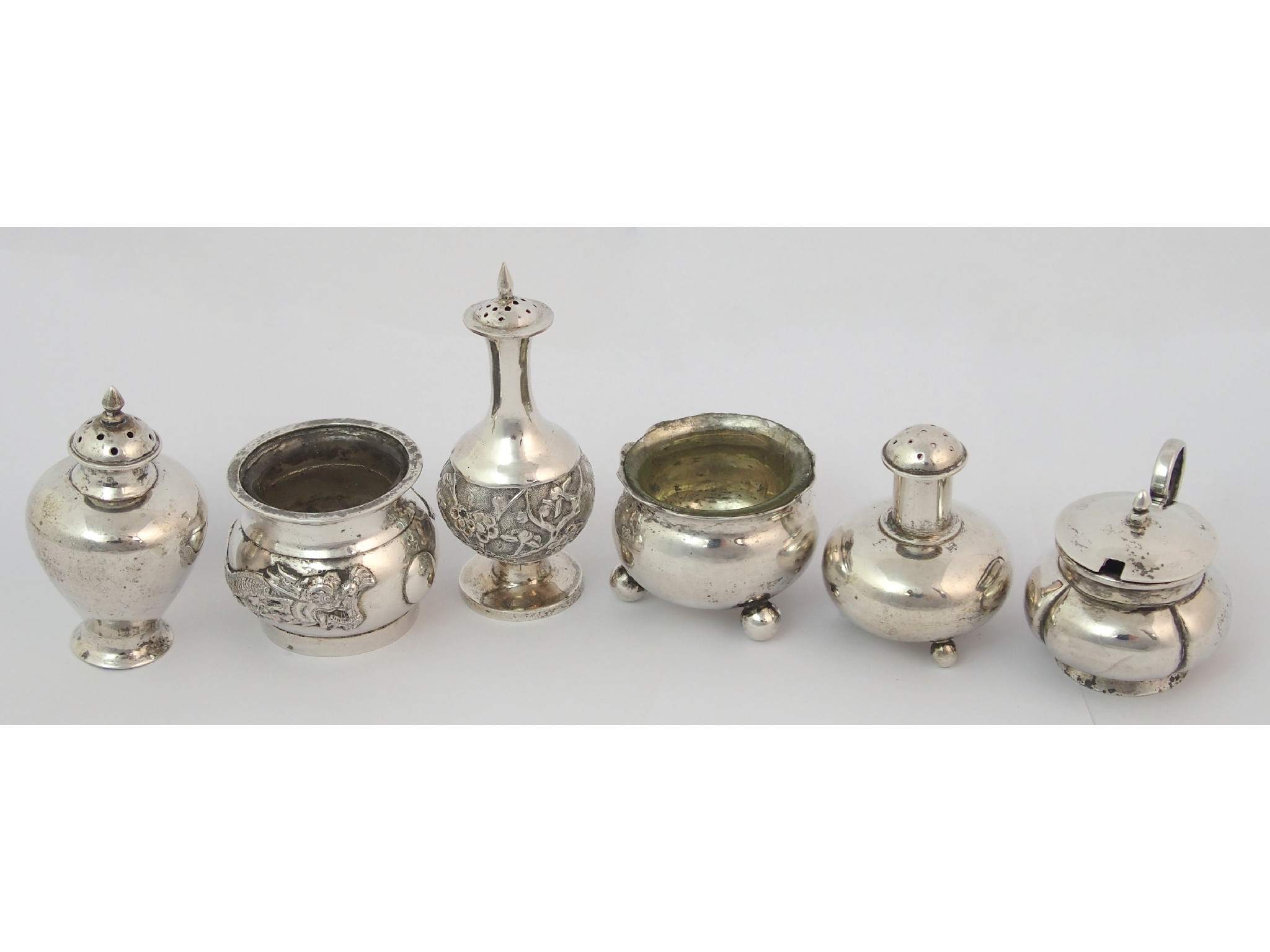 Appraisal: A Chinese silver pepper caster and salt cellarcast with a