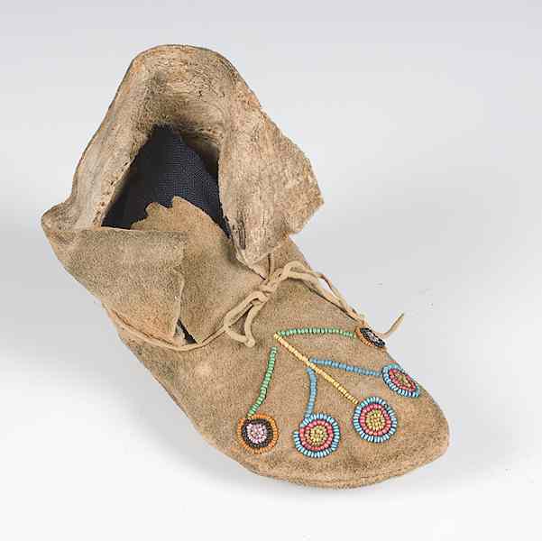 Appraisal: Crow Beaded Hide Child's Moccasin single thread-sewn and beaded using