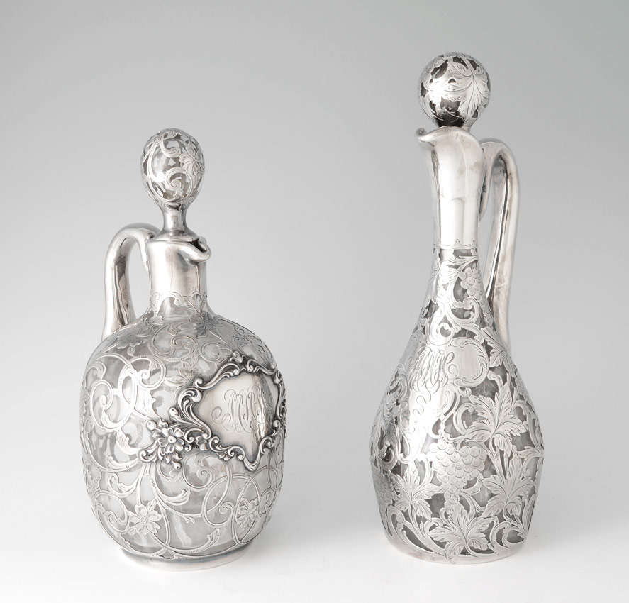 Appraisal: STERLING SILVER OVERLAY DECANTERS Both pieces have a heavy silver