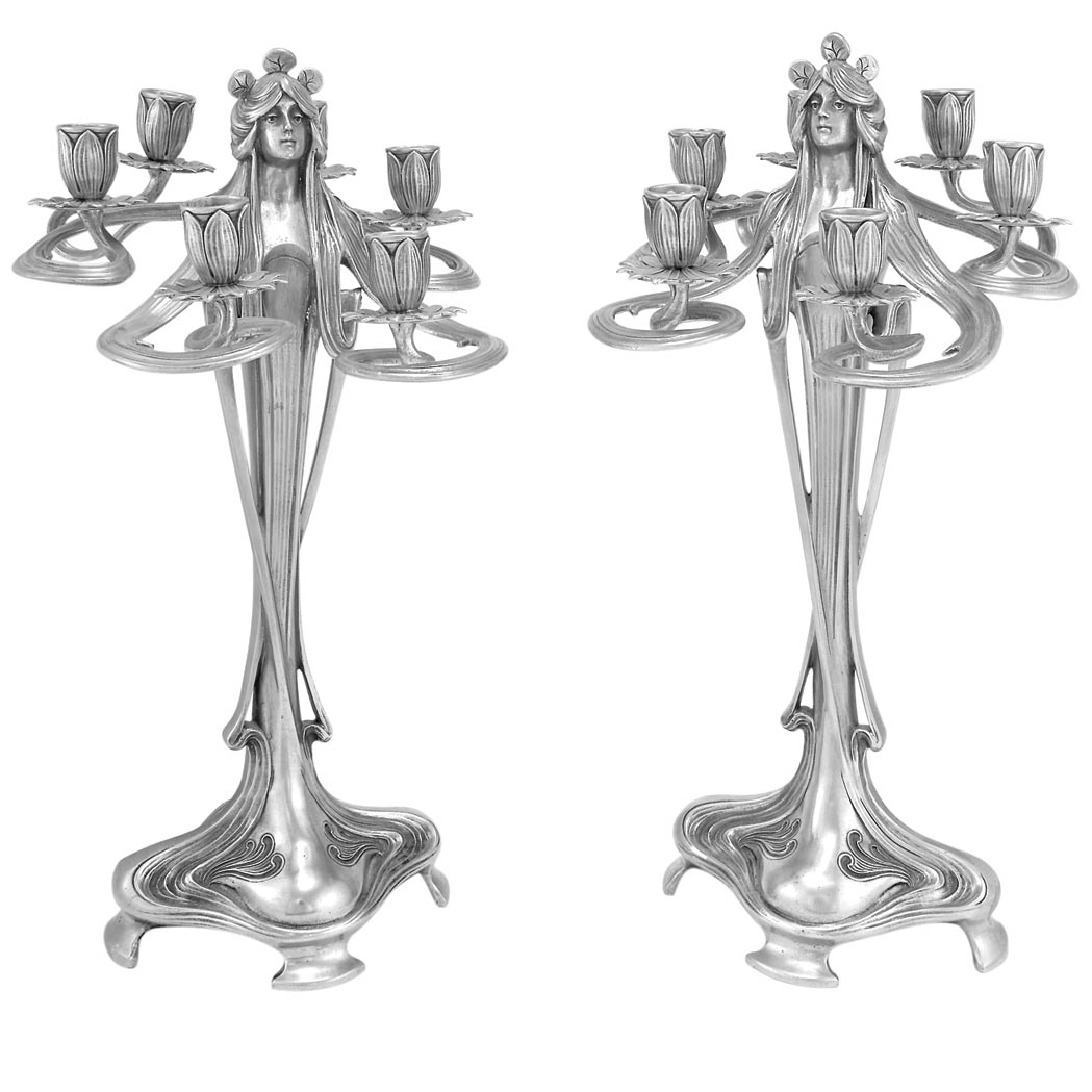 Appraisal: Companion Pair of Continental Art Nouveau Pewter Figural Six-Light Candelabra