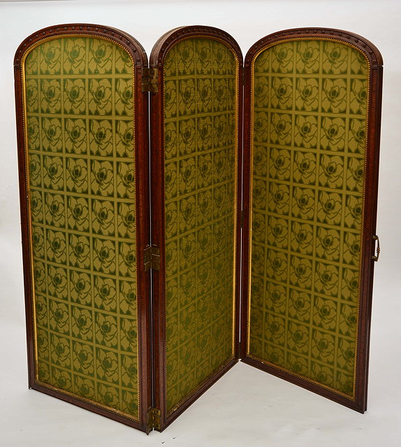 Appraisal: A VICTORIAN WALNUT THREE FOLD SCREEN the arching top with