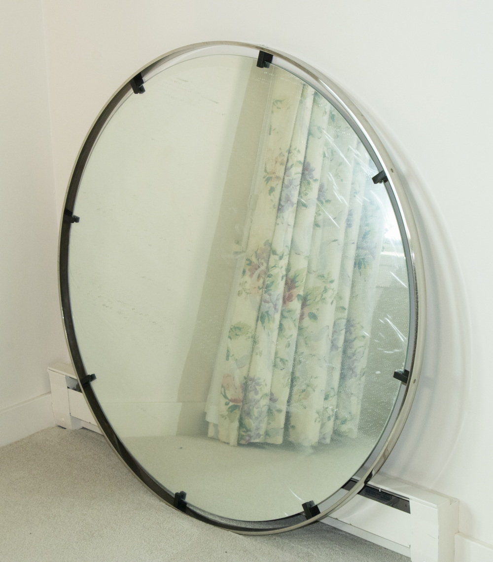 Appraisal: CIRCULAR MIRROR WITH STAINLESS STEEL FRAME Large circular bedroom mirror