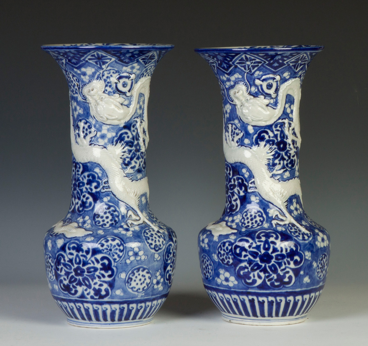 Appraisal: Pair of Chinese Blue White Porcelain Vases Relief raised dragons