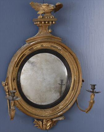 Appraisal: REGENCY CARVED GILTWOOD TWO-LIGHT GIRANDOLE The convex plate within ebonized