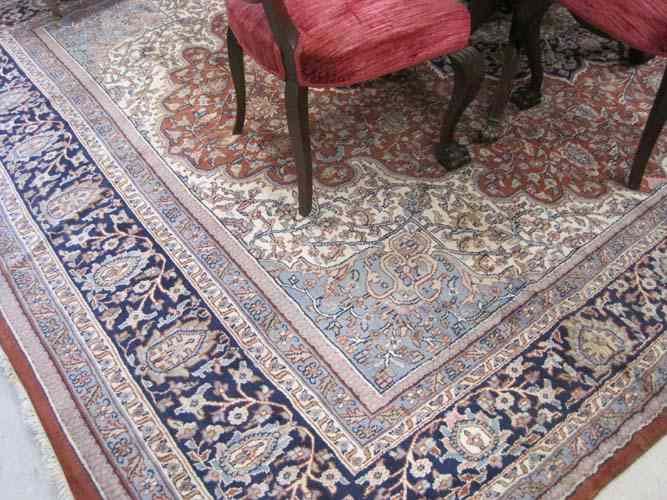 Appraisal: HAND KNOTTED ORIENTAL CARPET Indo-Persian floral and central floral medallion