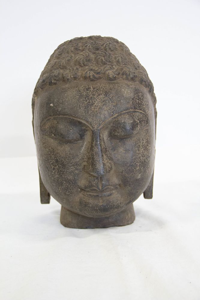 Appraisal: A Northern Qi Limestone Head of Buddha The buddha with