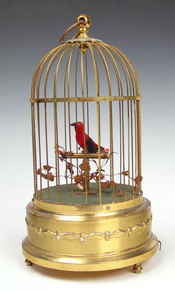 Appraisal: GERMAN SINGING BIRD AUTOMATON Single bird in a brass cage