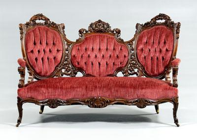 Appraisal: Rococo revival carved rosewood sofa elaborately pierced and florally carved