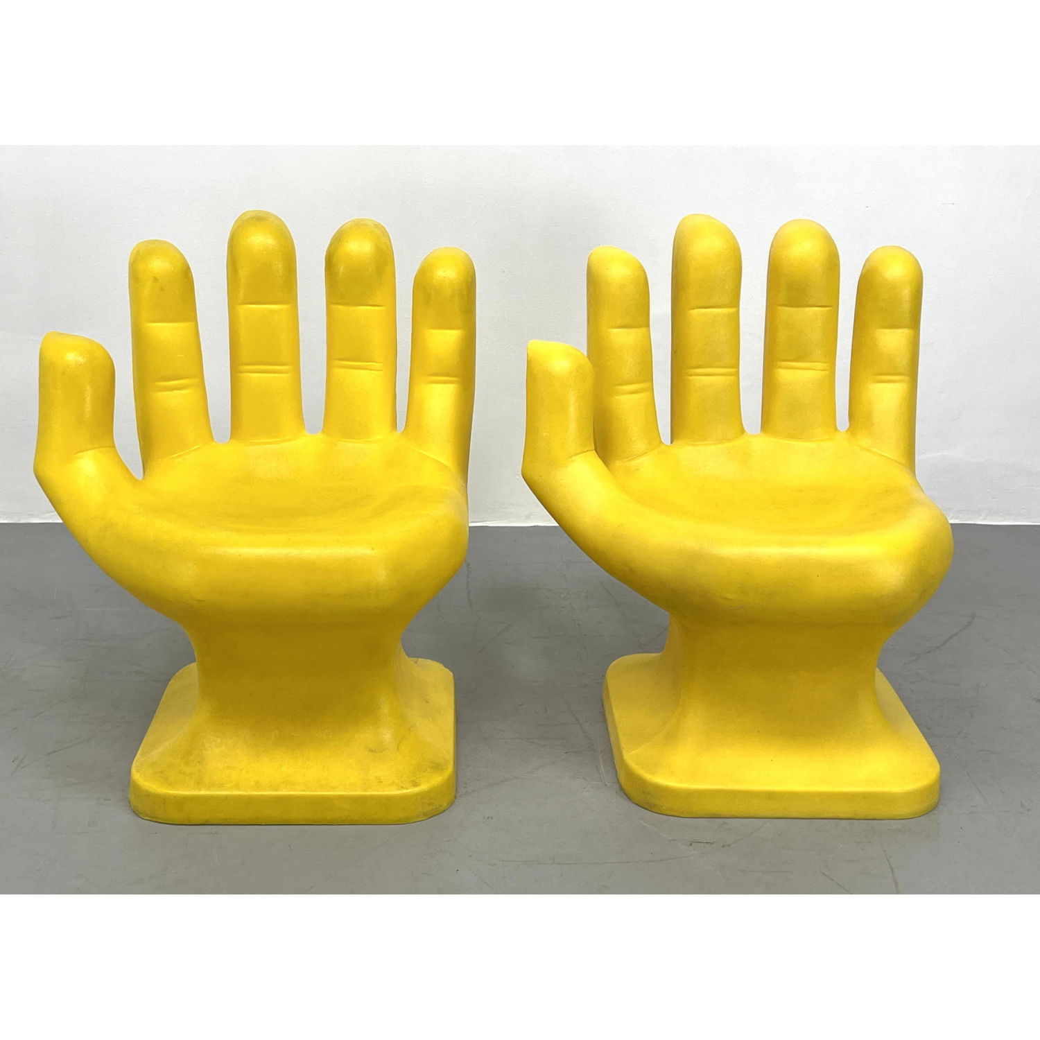 Appraisal: Pr Yellow Molded Plastic Figural Hand Lounge Chair Marked Made