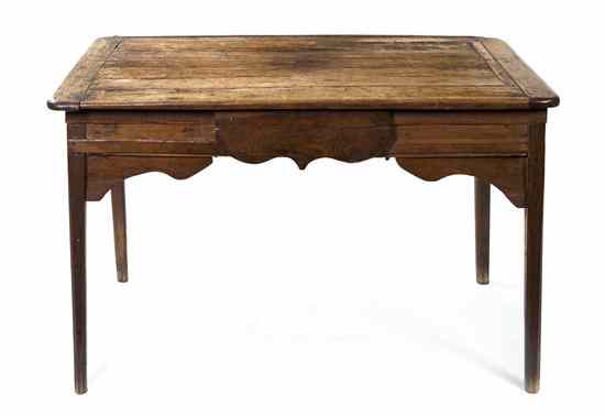 Appraisal: A Provincial Oak Writing Desk having a rectangular top with