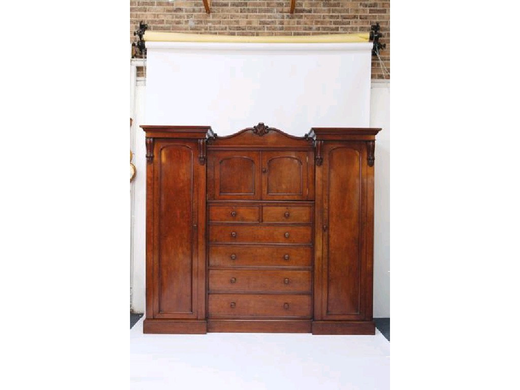 Appraisal: A VICTORIAN MAHOGANY WARDROBE with an inverted break front the