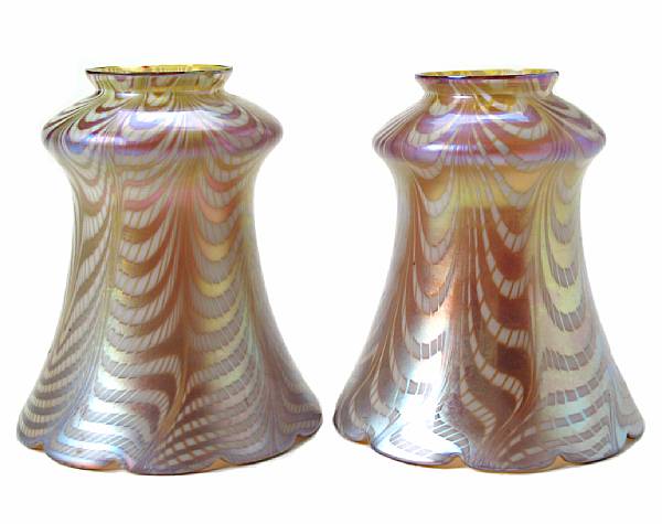 Appraisal: A pair of Steuben gold and white Aurene glass lampshades