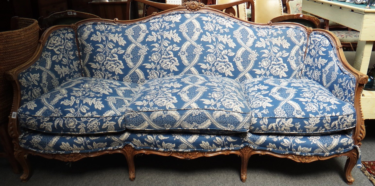 Appraisal: A Louis XV style beech framed sofa with floral carved