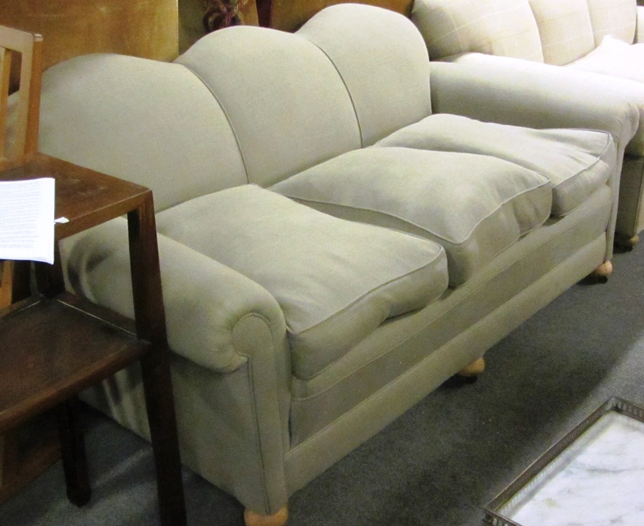 Appraisal: A mid th century grey upholstered triple hump-backed sofa cm