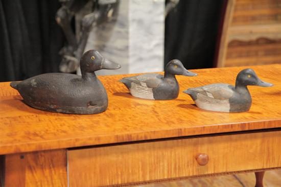 Appraisal: THREE DECOYS Including two miniature Carved and polychrome painted wood