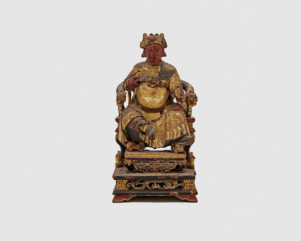 Appraisal: Carved Painted and Gilt Decorated Figure of a Deity Seated