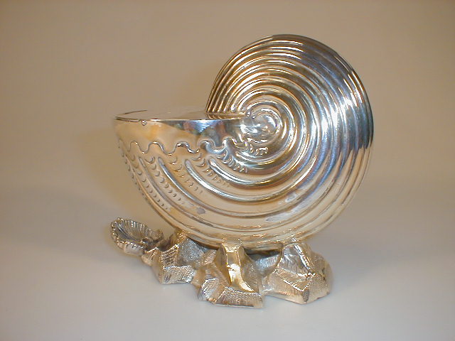 Appraisal: A Victorian electroplate spoon warmer modelled as a nautilus shell