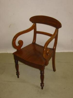 Appraisal: A CHILD'S VICTORIAN WALNUT FRAMED ARMCHAIR of spoon back form