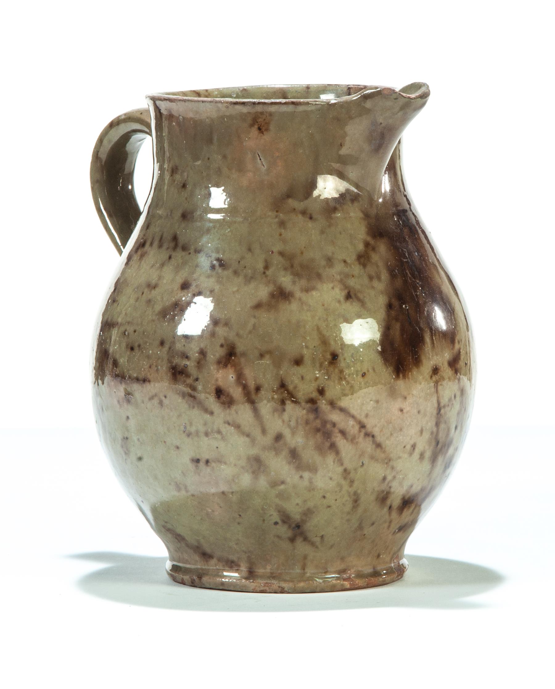 Appraisal: NEW ENGLAND REDWARE PITCHER Mid th century Sage green glaze