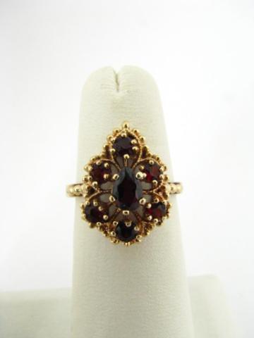 Appraisal: Vintage K yellow gold ring with seven garnets mounted in