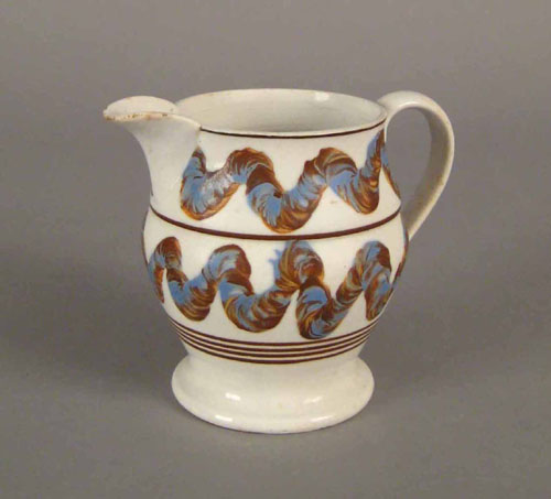 Appraisal: Mocha pitcher th c with earthworm decoration on a white