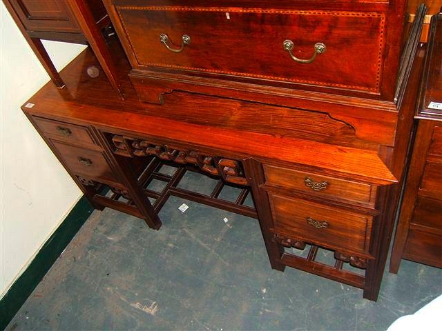 Appraisal: An Oriental padouk wood side table with two drawers either