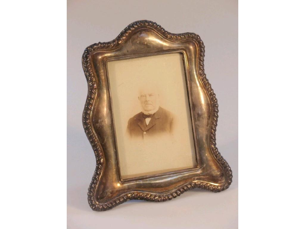 Appraisal: A late Victorian silver photograph frame of shaped rectangular design