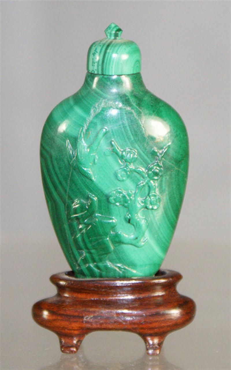 Appraisal: Finely carved malachite snuff bottle bird floral design matching stopper