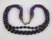 Appraisal: A three strand faceted amethyst bead and silver necklace approx