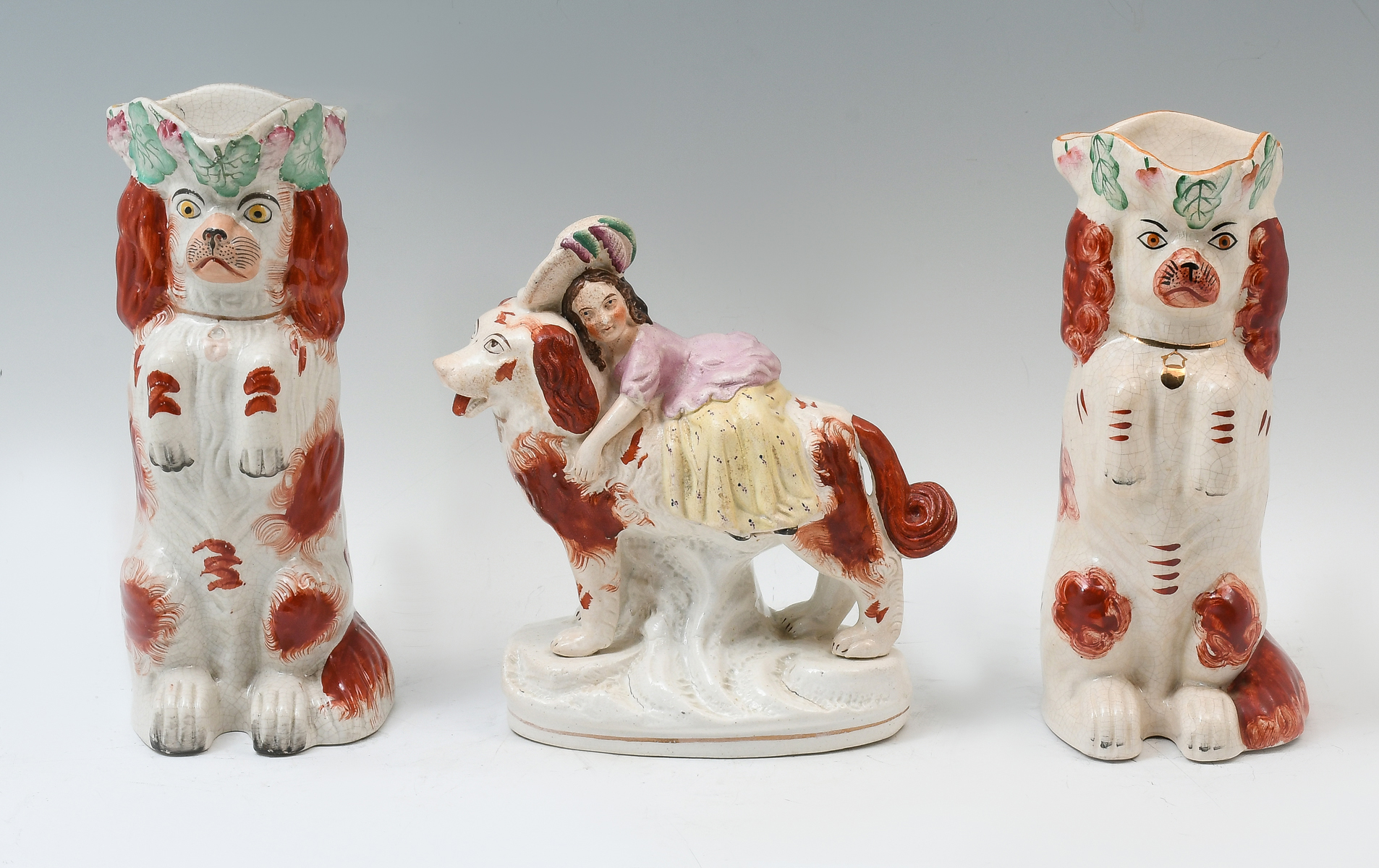 Appraisal: PC STAFFORDSHIRE PORCELAIN DOG COLLECTION Comprising - Begging Spaniel pitchers