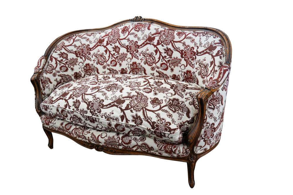 Appraisal: CARVED WALNUT FRENCH PROVINCIAL CANAPECondition the cushiom upholstery in brown