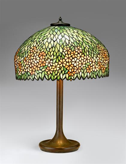 Appraisal: Leaded glass and bronze table lamp early th century The